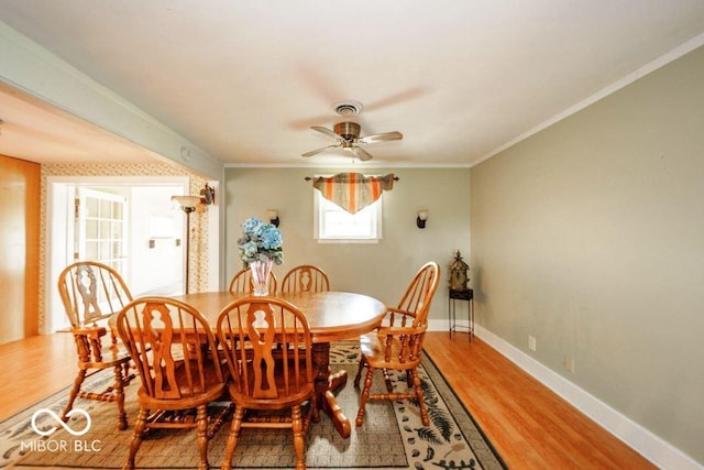 17310 N Willman Rd, Eaton, IN 47338 - dining room featuring light wood-type flooring, a ceiling fan, ornamental molding, and baseboards