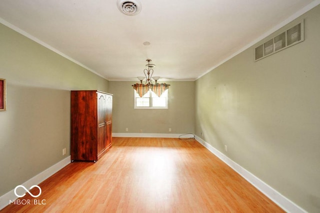 17310 N Willman Rd, Eaton, IN 47338 - unfurnished dining area featuring light wood finished floors, a chandelier, ornamental molding, and baseboards