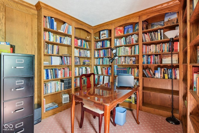 9240 E Woodview Dr, Bloomington, IN 47401 - living area with carpet flooring and wall of books