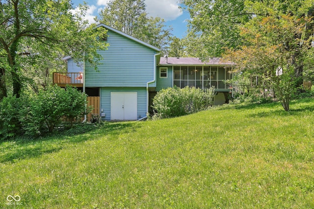 9240 E Woodview Dr, Bloomington, IN 47401 - rear view of property with a sunroom, a lawn, and a wooden deck
