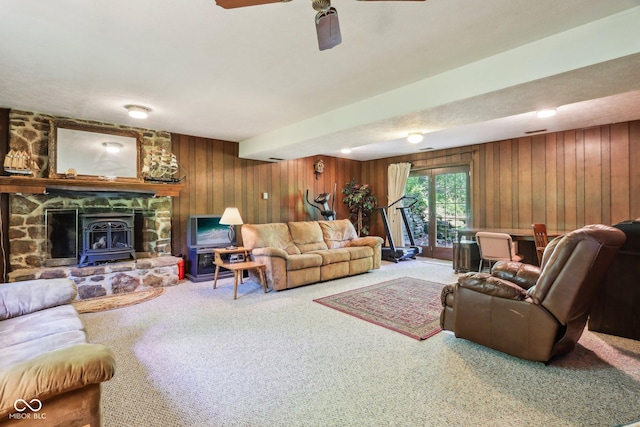 9240 E Woodview Dr, Bloomington, IN 47401 - carpeted living room featuring wood walls and ceiling fan