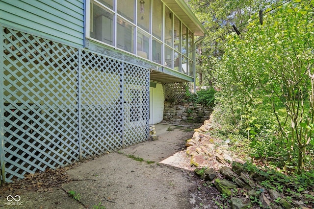 9240 E Woodview Dr, Bloomington, IN 47401 - view of home's exterior featuring a sunroom