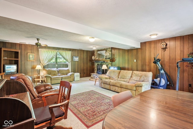 9240 E Woodview Dr, Bloomington, IN 47401 - carpeted living room with wooden walls and ceiling fan