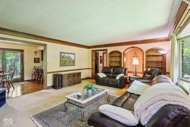 9240 E Woodview Dr, Bloomington, IN 47401 - living room featuring plenty of natural light, crown molding, built in shelves, and carpet flooring