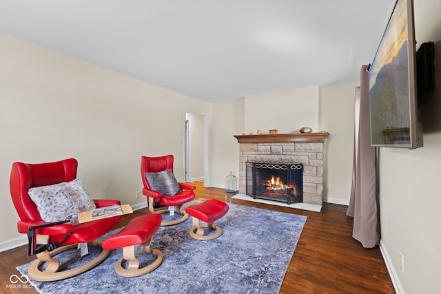 909 E Markwood Ave, Indianapolis, IN 46227 - living area with a fireplace, wood finished floors, and baseboards