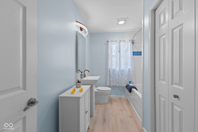 909 E Markwood Ave, Indianapolis, IN 46227 - full bath with toilet, wood finished floors, shower / tub combo, and vanity