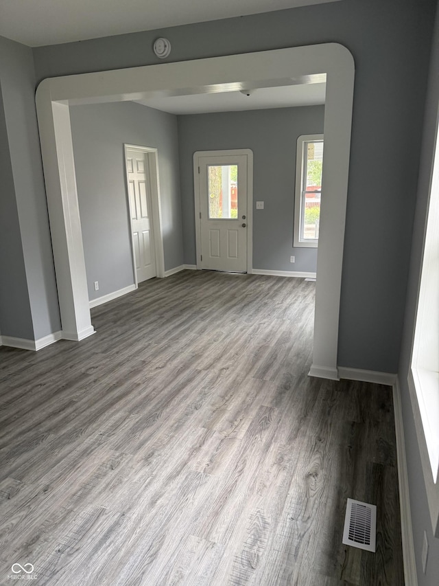 23 S Holmes Ave, Indianapolis, IN 46222 - unfurnished room with wood finished floors and baseboards