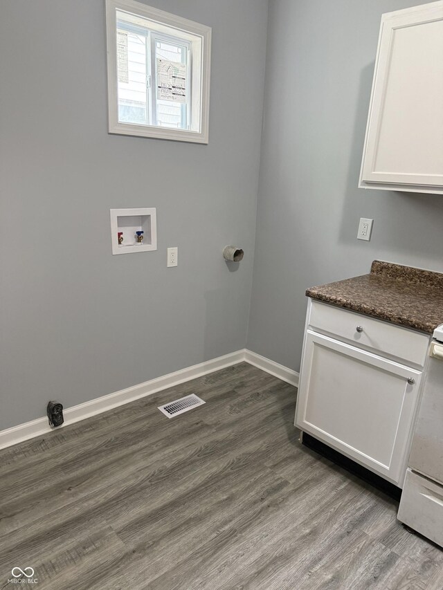 23 S Holmes Ave, Indianapolis, IN 46222 - laundry area featuring washer hookup, dark wood-style flooring, and baseboards