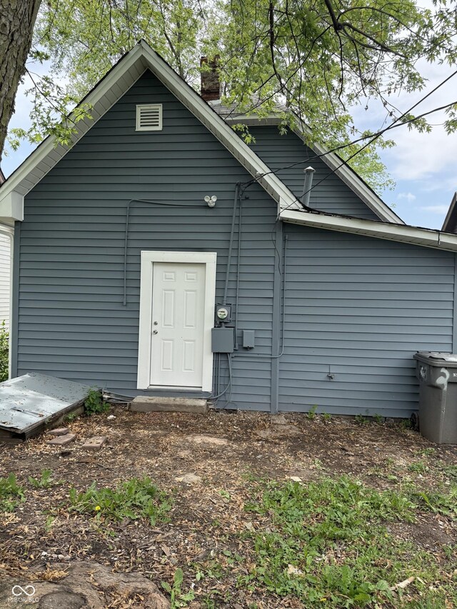 23 S Holmes Ave, Indianapolis, IN 46222 - rear view of house with a chimney