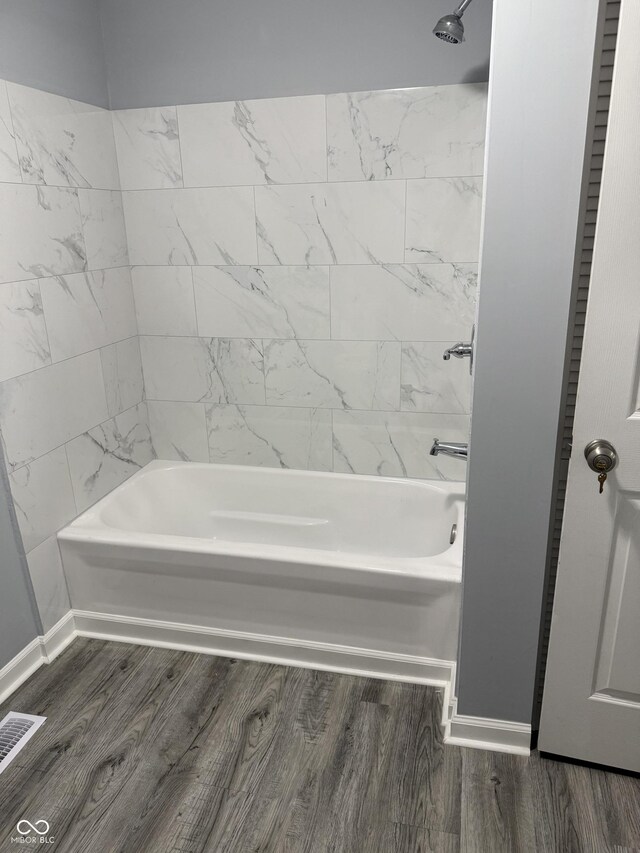 23 S Holmes Ave, Indianapolis, IN 46222 - full bath featuring bathtub / shower combination and wood finished floors