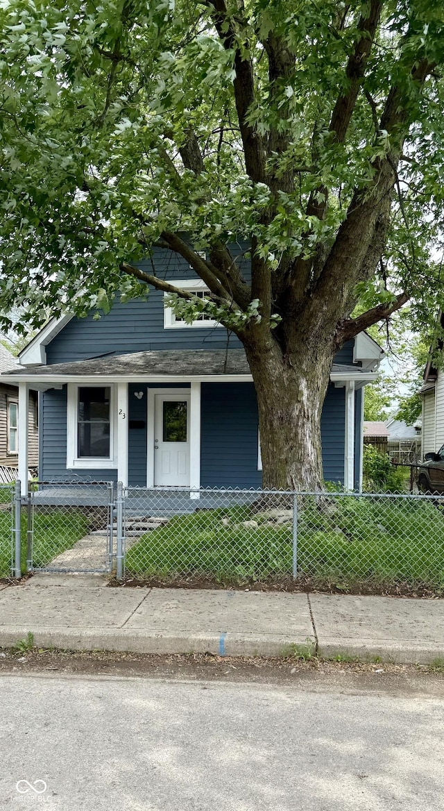23 S Holmes Ave, Indianapolis, IN 46222 - view of front of house with a porch and a fenced front yard
