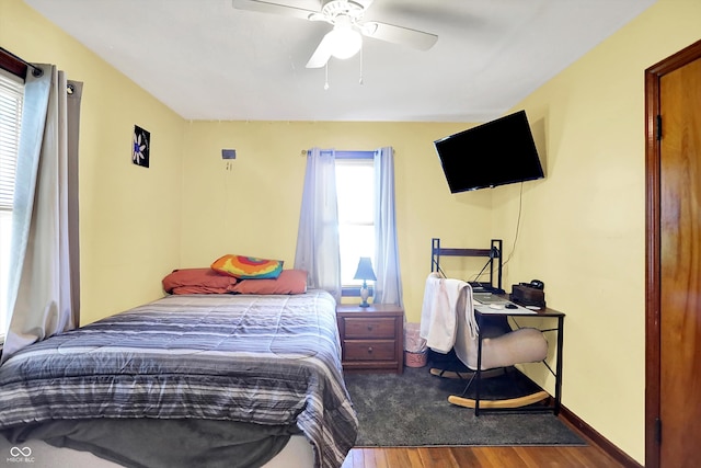 3310 Ransdell St, Indianapolis, IN 46227 - bedroom with wood finished floors, baseboards, ceiling fan, and a desk