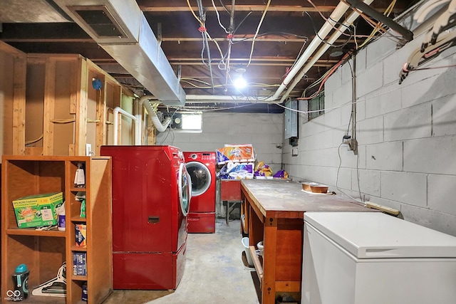 3310 Ransdell St, Indianapolis, IN 46227 - basement featuring washing machine and clothes dryer, refrigerator, and concrete block wall