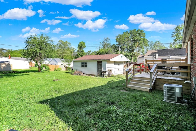 3310 Ransdell St, Indianapolis, IN 46227 - view of yard featuring central AC unit, a deck, and an outbuilding