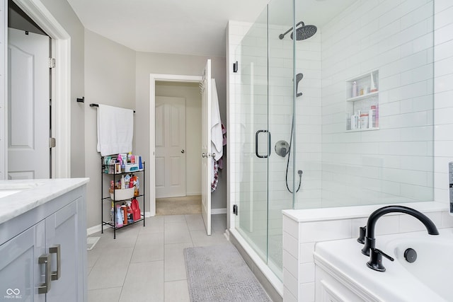 14135 Nicholas Dr, Carmel, IN 46074 - full bathroom with a stall shower, a bath, vanity, tile patterned flooring, and baseboards
