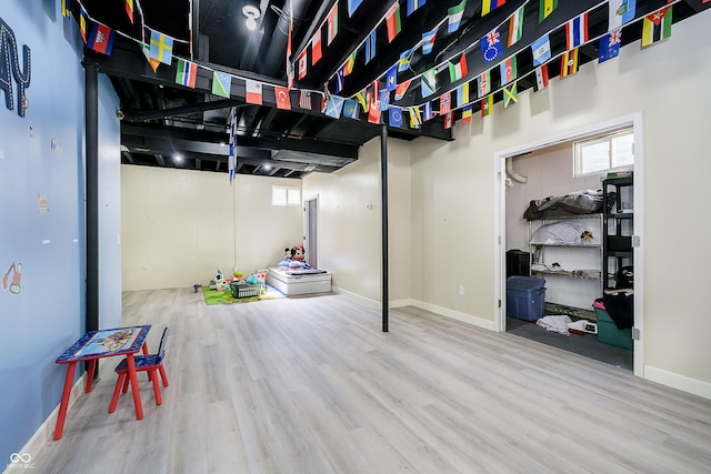 14135 Nicholas Dr, Carmel, IN 46074 - below grade area featuring wood finished floors and baseboards