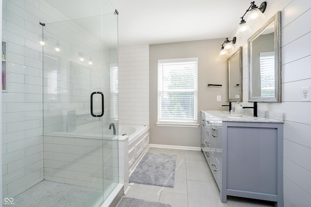 14135 Nicholas Dr, Carmel, IN 46074 - full bath featuring double vanity, tile patterned flooring, baseboards, a stall shower, and a bath