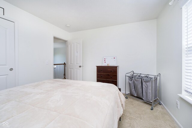 14135 Nicholas Dr, Carmel, IN 46074 - bedroom with light carpet and baseboards