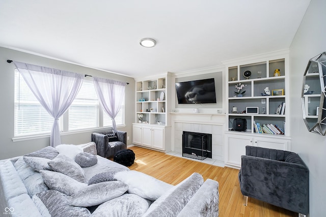 14135 Nicholas Dr, Carmel, IN 46074 - living area with light wood-style floors and a tiled fireplace