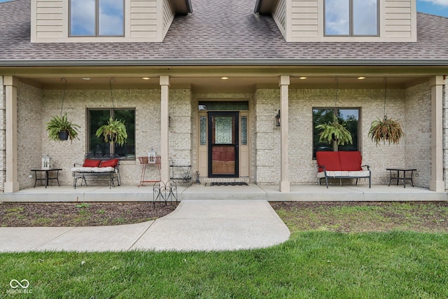 2825 S State Road 267, Plainfield, IN 46168 - property entrance featuring a porch, a shingled roof, and brick siding
