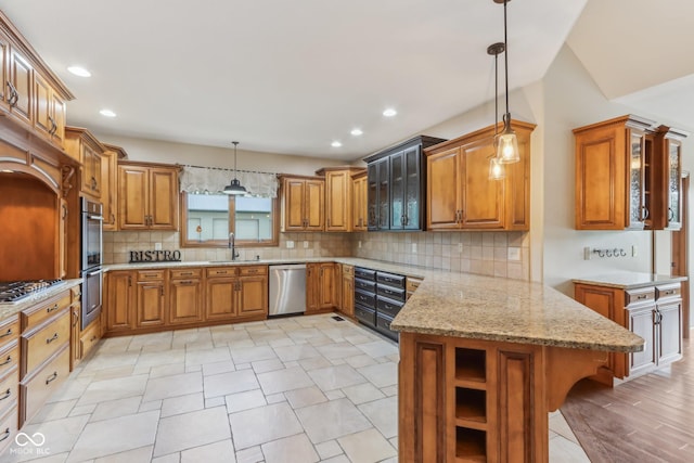 2825 S State Road 267, Plainfield, IN 46168 - kitchen with appliances with stainless steel finishes, a sink, brown cabinets, a peninsula, and glass insert cabinets