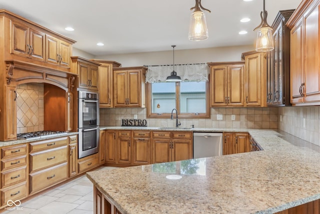 2825 S State Road 267, Plainfield, IN 46168 - kitchen featuring stainless steel appliances, a sink, light stone counters, recessed lighting, and a peninsula