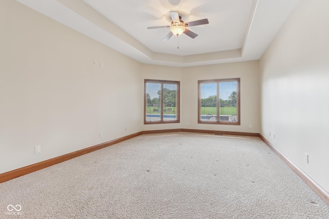 2825 S State Road 267, Plainfield, IN 46168 - unfurnished room with light colored carpet, ceiling fan, a tray ceiling, and baseboards