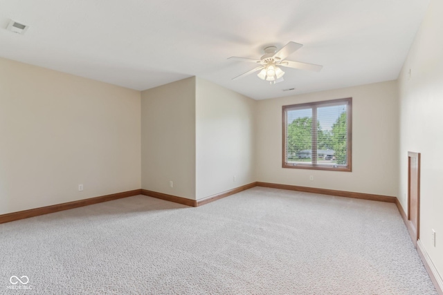 2825 S State Road 267, Plainfield, IN 46168 - spare room featuring a ceiling fan, light colored carpet, and baseboards