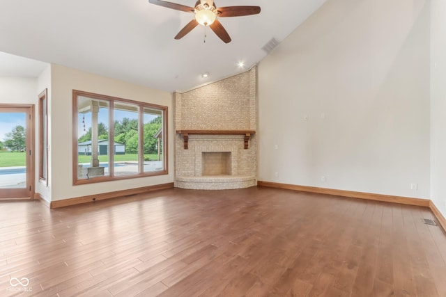 2825 S State Road 267, Plainfield, IN 46168 - unfurnished living room with lofted ceiling, healthy amount of natural light, wood finished floors, a ceiling fan, and baseboards