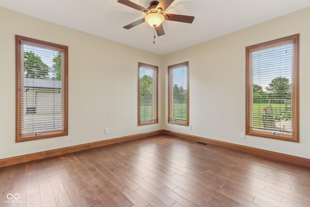 2825 S State Road 267, Plainfield, IN 46168 - spare room featuring plenty of natural light, baseboards, and wood finished floors