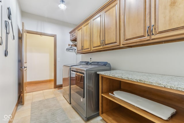 2825 S State Road 267, Plainfield, IN 46168 - laundry area with independent washer and dryer, cabinet space, light tile patterned floors, and baseboards