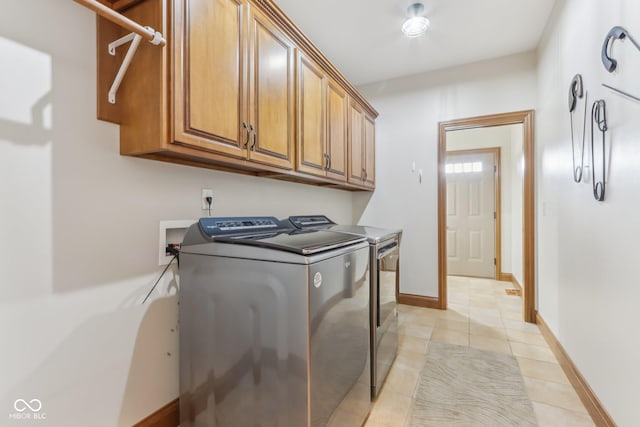 2825 S State Road 267, Plainfield, IN 46168 - washroom with cabinet space, washing machine and dryer, light tile patterned flooring, and baseboards