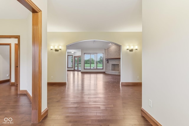 2825 S State Road 267, Plainfield, IN 46168 - hallway featuring arched walkways, wood finished floors, and baseboards