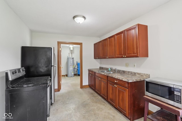 2825 S State Road 267, Plainfield, IN 46168 - kitchen featuring stainless steel appliances, electric water heater, a sink, and concrete floors