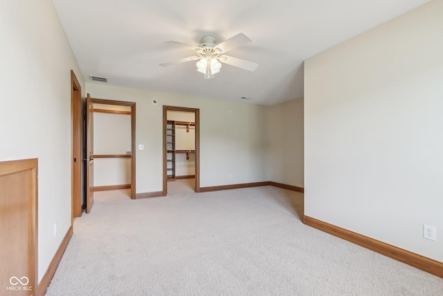 2825 S State Road 267, Plainfield, IN 46168 - unfurnished bedroom with light carpet, baseboards, and ceiling fan