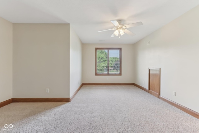 2825 S State Road 267, Plainfield, IN 46168 - spare room featuring light colored carpet, baseboards, and a ceiling fan