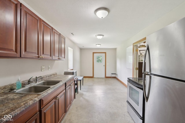 2825 S State Road 267, Plainfield, IN 46168 - kitchen with stainless steel appliances, a sink, finished concrete flooring, and baseboards