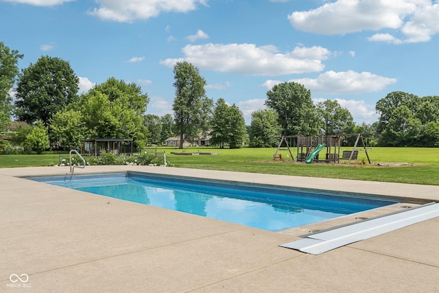 2825 S State Road 267, Plainfield, IN 46168 - outdoor pool with a playground, a lawn, and view of wooded area