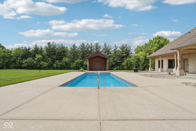 2825 S State Road 267, Plainfield, IN 46168 - swimming pool featuring a yard, a patio area, view of wooded area, and an outbuilding
