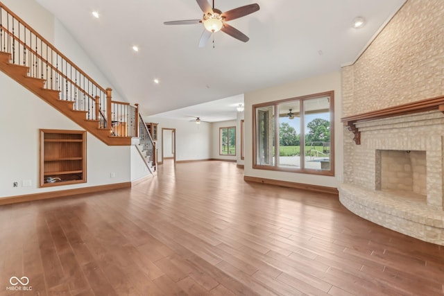 2825 S State Road 267, Plainfield, IN 46168 - unfurnished living room with a ceiling fan, stairs, wood finished floors, high vaulted ceiling, and recessed lighting