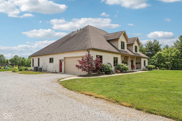 2825 S State Road 267, Plainfield, IN 46168 - view of side of property with driveway, a garage, a lawn, cooling unit, and a shingled roof