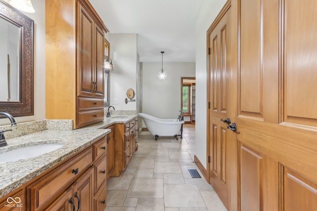 2825 S State Road 267, Plainfield, IN 46168 - full bathroom with a soaking tub, two vanities, and stone finish floors