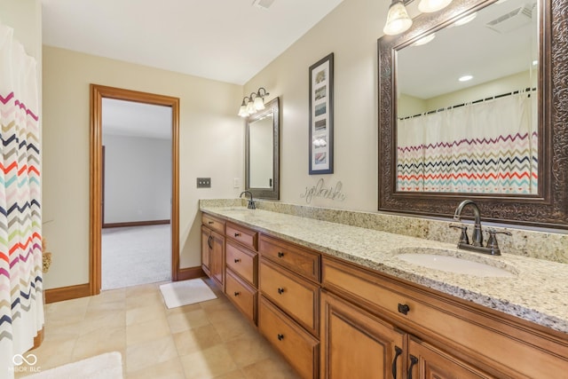 2825 S State Road 267, Plainfield, IN 46168 - bathroom with double vanity, baseboards, and tile patterned floors