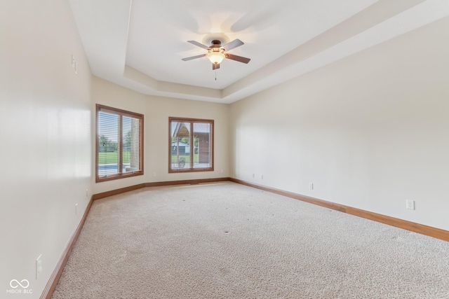 2825 S State Road 267, Plainfield, IN 46168 - empty room featuring light carpet, a ceiling fan, baseboards, and a tray ceiling
