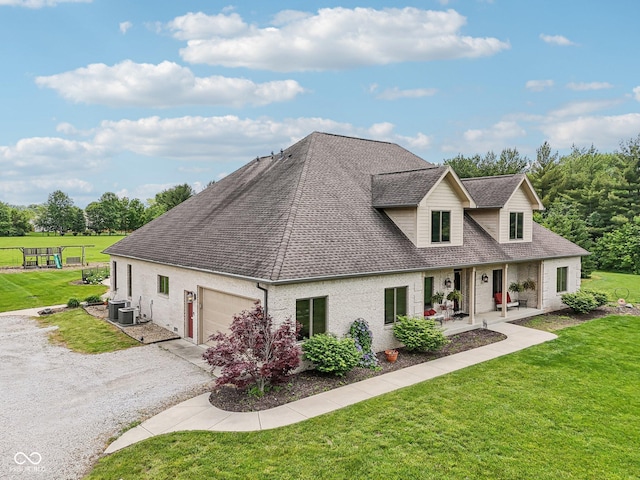 2825 S State Road 267, Plainfield, IN 46168 - view of front facade featuring roof with shingles, an attached garage, central AC, gravel driveway, and a front lawn