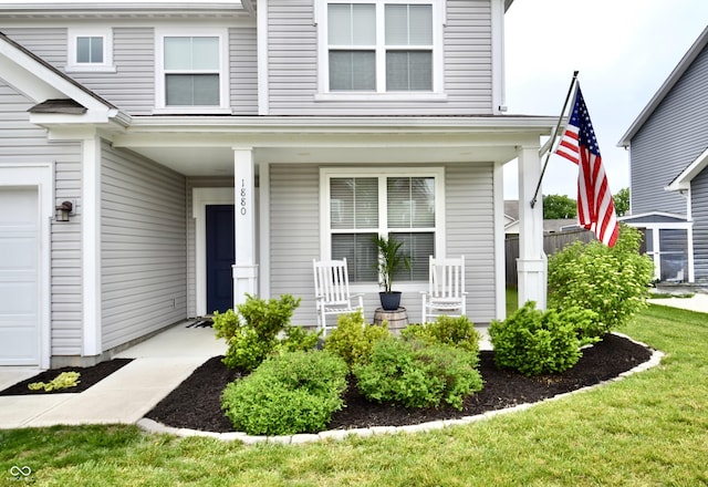 1880 Explorer Ct, Franklin, IN 46131 - property entrance with a porch and a garage