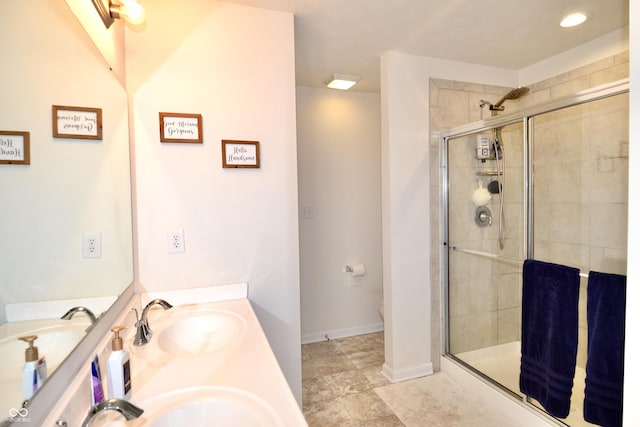 1880 Explorer Ct, Franklin, IN 46131 - bathroom featuring tiled shower, toilet, double vanity, and baseboards
