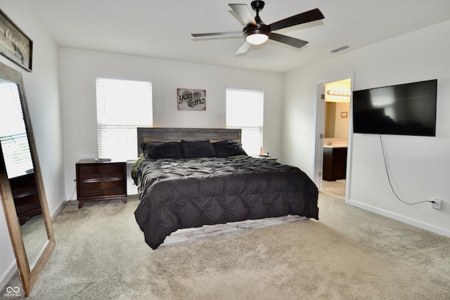 1880 Explorer Ct, Franklin, IN 46131 - bedroom featuring light carpet, baseboards, connected bathroom, and ceiling fan