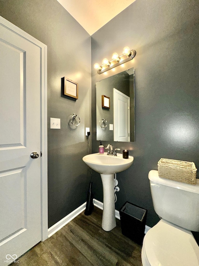 1880 Explorer Ct, Franklin, IN 46131 - half bathroom with wood finished floors, baseboards, toilet, and a sink