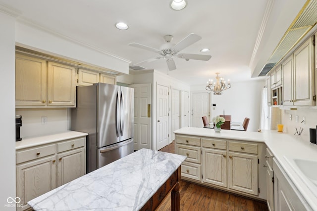 410 Sugar Tree Ln, Indianapolis, IN 46260 - kitchen with freestanding refrigerator, crown molding, dark wood finished floors, a peninsula, and a ceiling fan